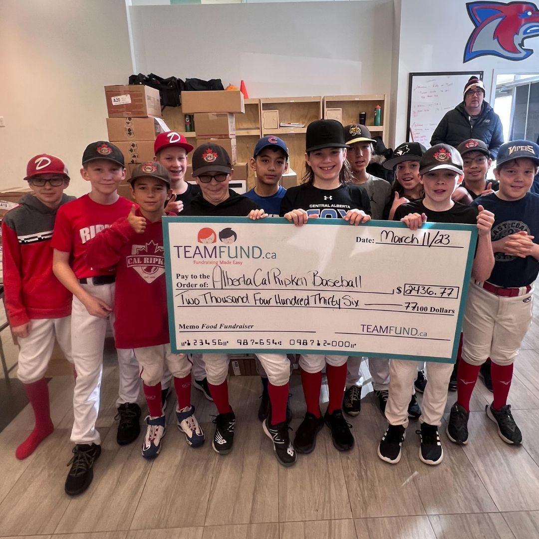 Wolverines Hockey Club, delivery in Calgary, June 2023. Holding cheque of all time raised over $36,000.