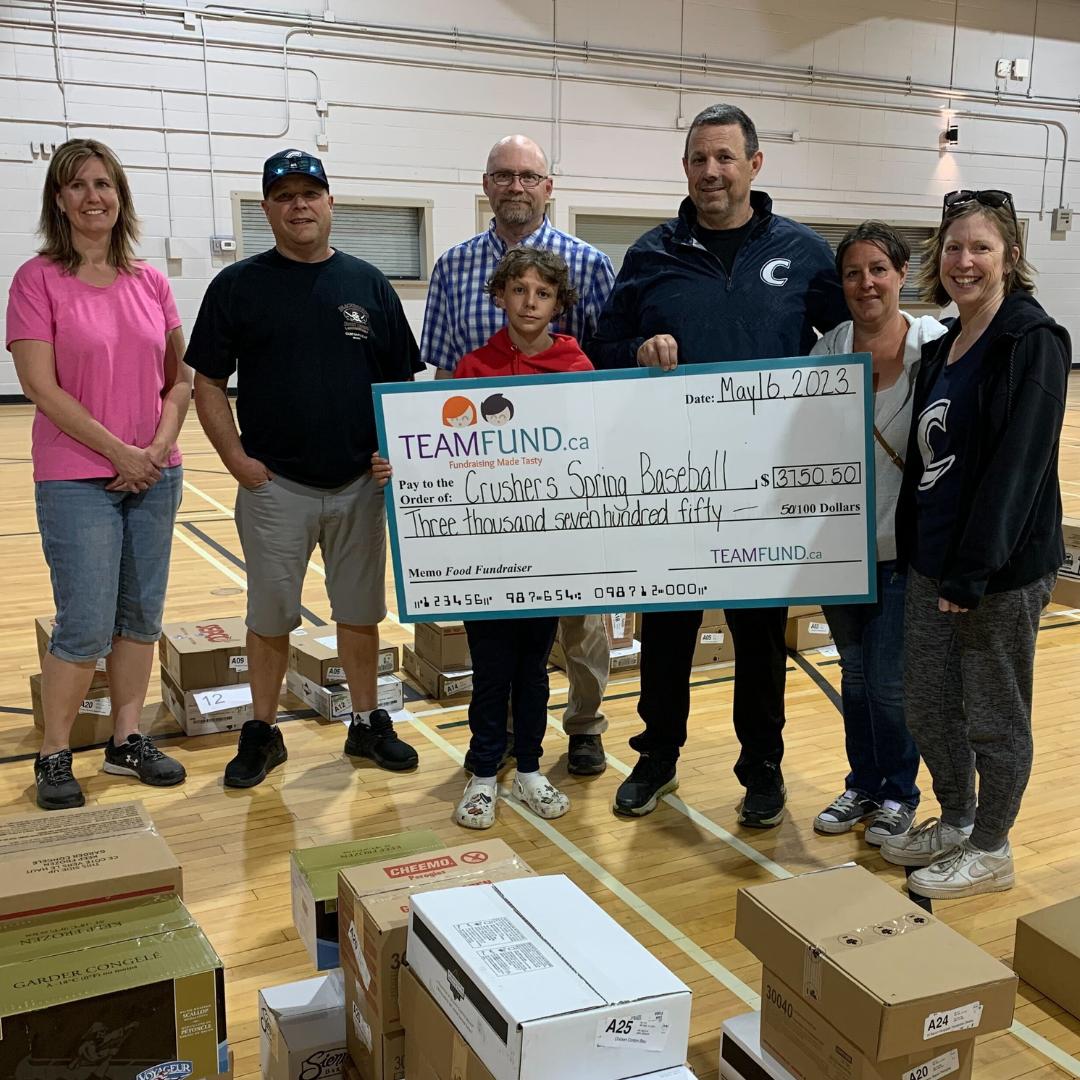 Wolverines Hockey Club, delivery in Calgary, June 2023. Holding cheque of all time raised over $36,000.