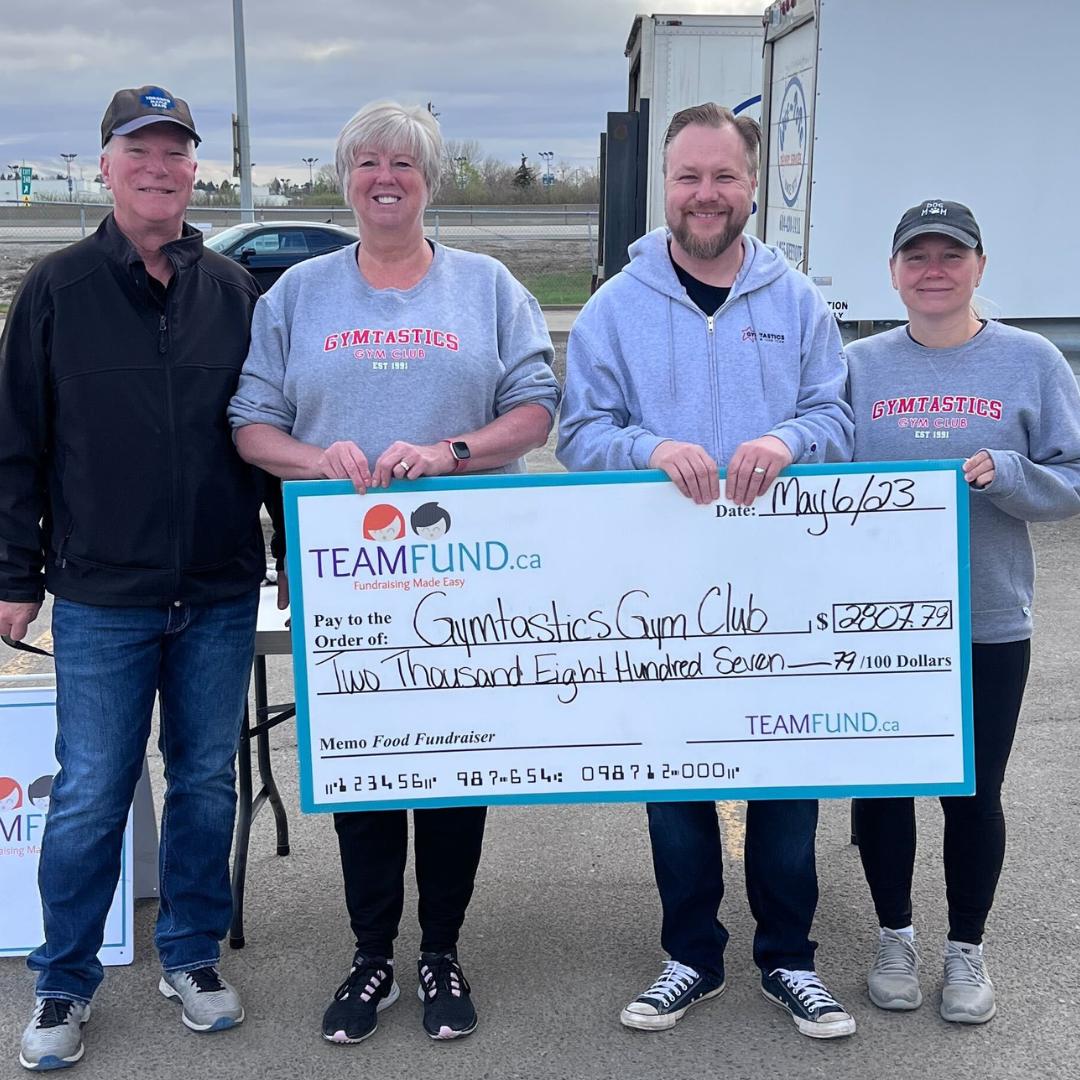 Wolverines Hockey Club, delivery in Calgary, June 2023. Holding cheque of all time raised over $36,000.