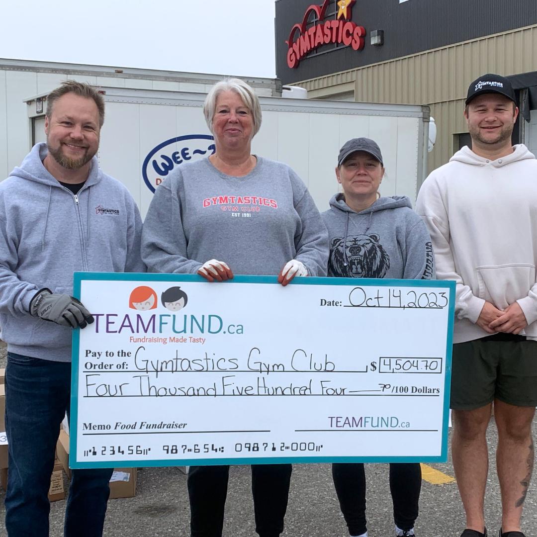 Wolverines Hockey Club, delivery in Calgary, June 2023. Holding cheque of all time raised over $36,000.