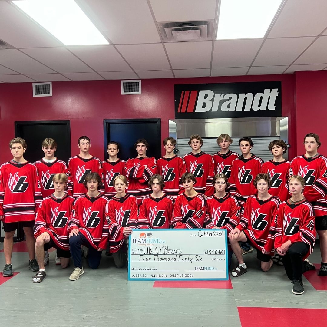 Wolverines Hockey Club, delivery in Calgary, June 2023. Holding cheque of all time raised over $36,000.