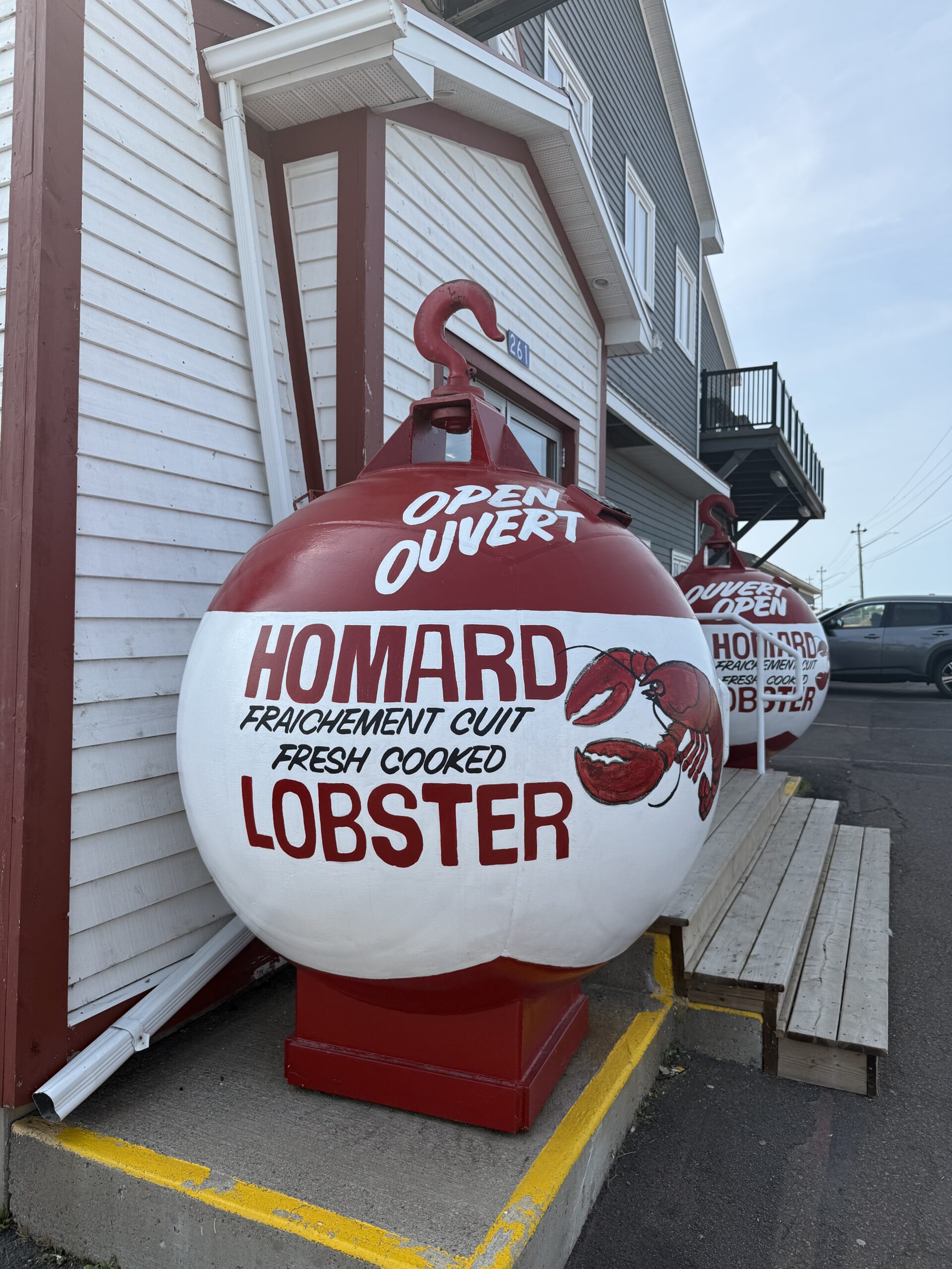 fresh-cooked-lobster-buoys Giant lobster buoys outside a seafood shop in Shediac, New Brunswick.